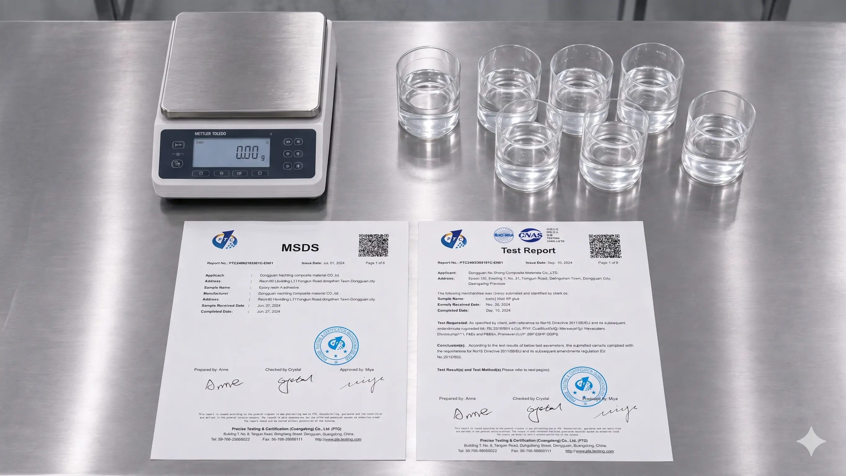 Laboratory bench with resin sample cups, weighing scale, MSDS document and test report for formula review