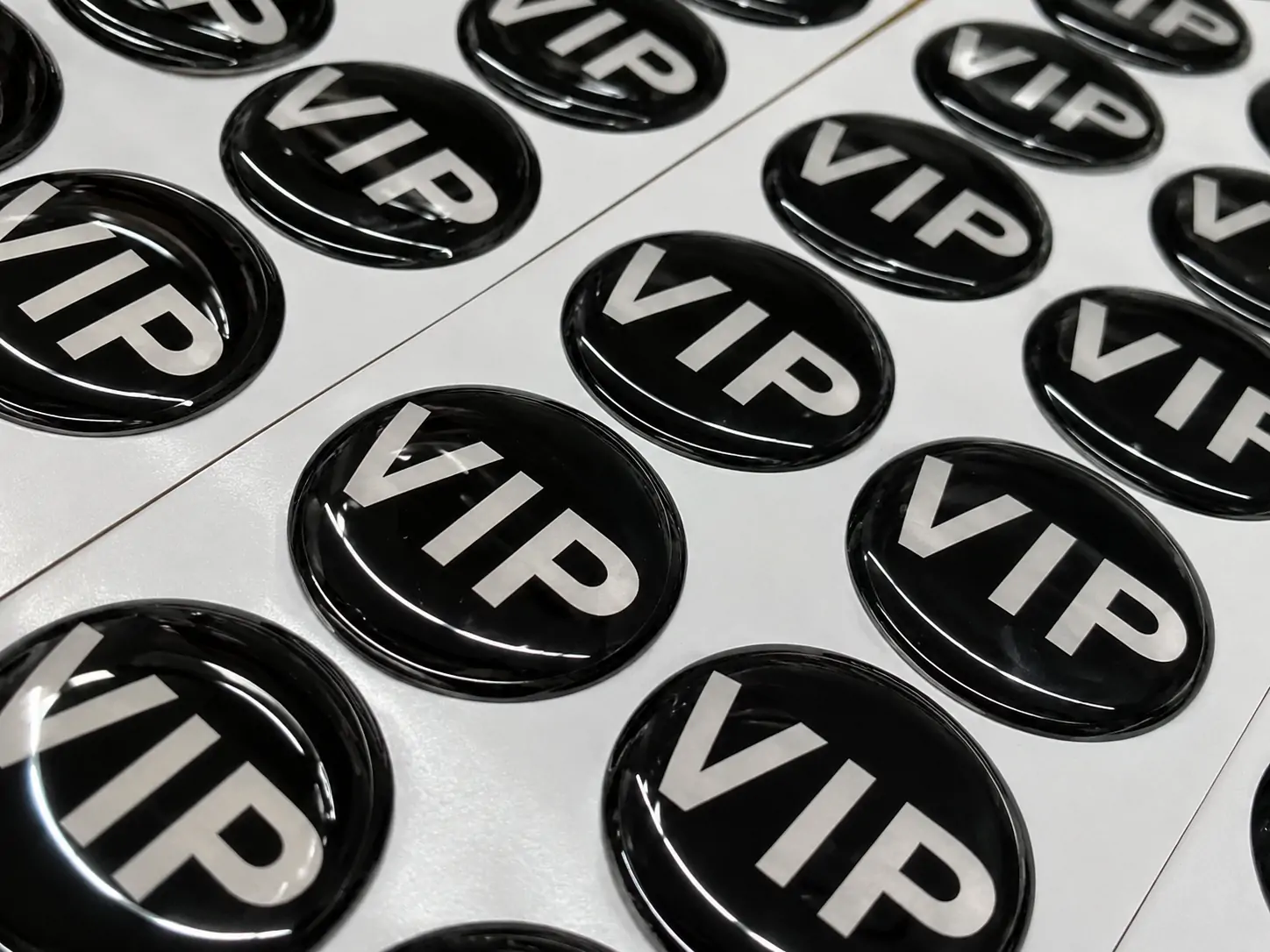 Finished 3D crystal domed label sample used on a branded product surface